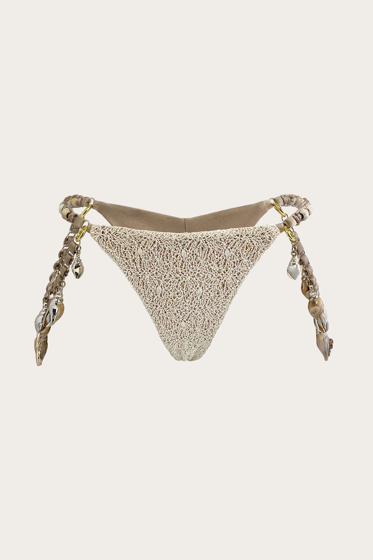 Merina thong bikini bottom in Sea Salt featuring detachable ASHERAH LINKS™ shell strands, gold-tone link accents, and textured knit fabric